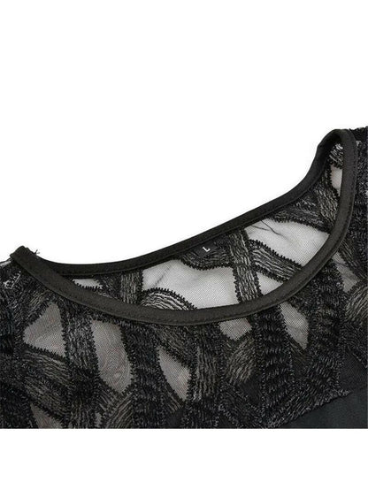 Close-up of the black dress neckline and sheer geometric fabric