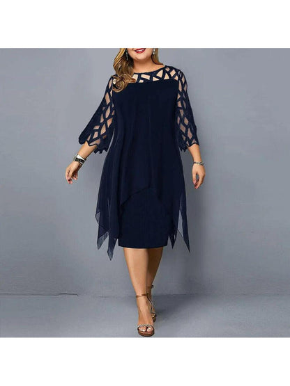 Woman wearing a deep-blue dress with geometric sheer sleeves, front view