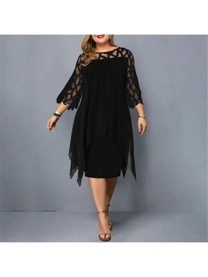 Woman wearing a black dress with geometric sheer sleeves, front view