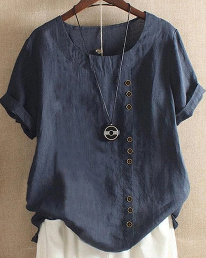 Light beige Beatrice casual blouse with relaxed fit and button detail, featuring a stylish and comfortable design.