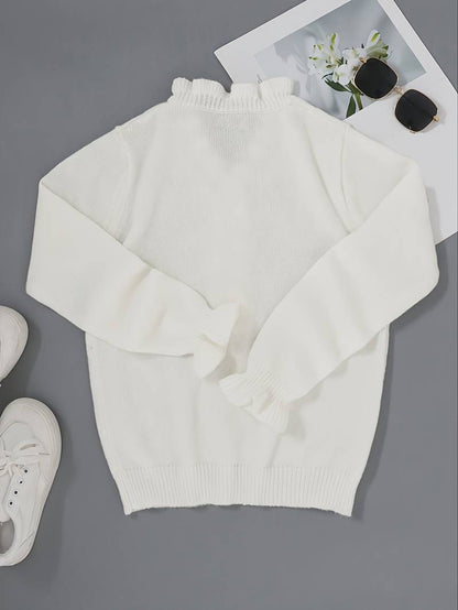 Victoria blouse featuring elegant ruffle design and decorative buttons, perfect for stylish women's fashion.
