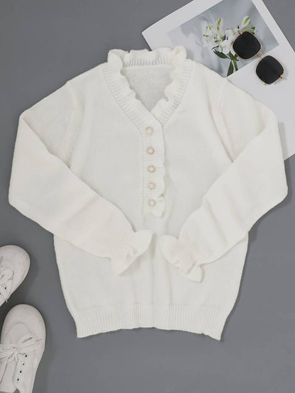 Victoria blouse featuring elegant ruffle design and decorative buttons, perfect for stylish women's fashion.