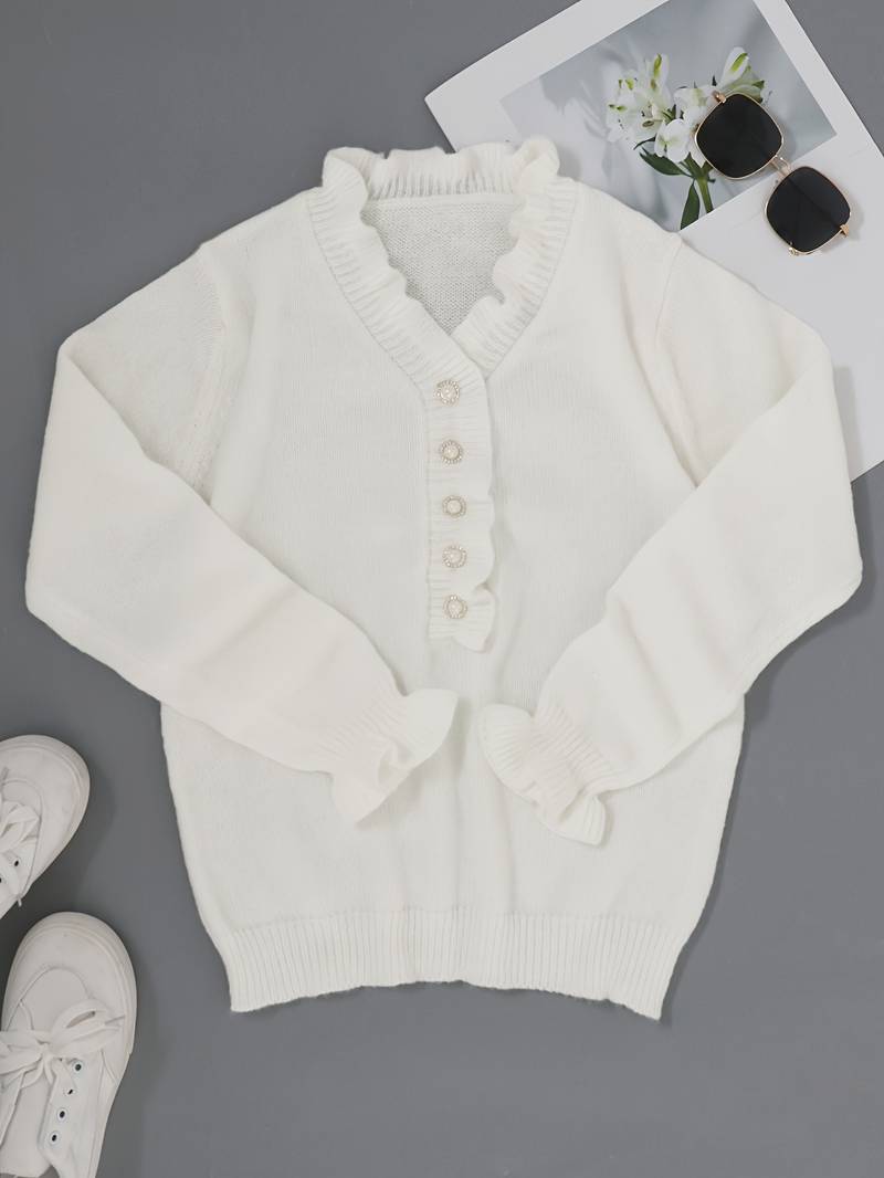 Victoria blouse featuring elegant ruffle design and decorative buttons, perfect for stylish women's fashion.