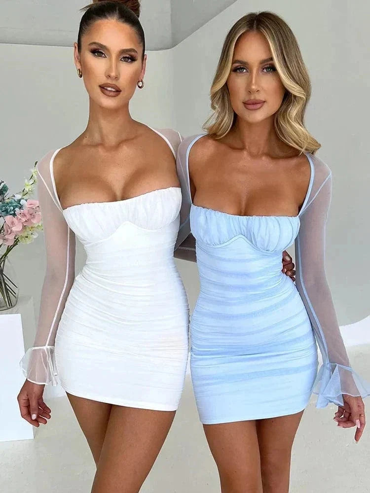 White Astraeon bodycon mini dress with ruched design, shown on a model, close-up front view.