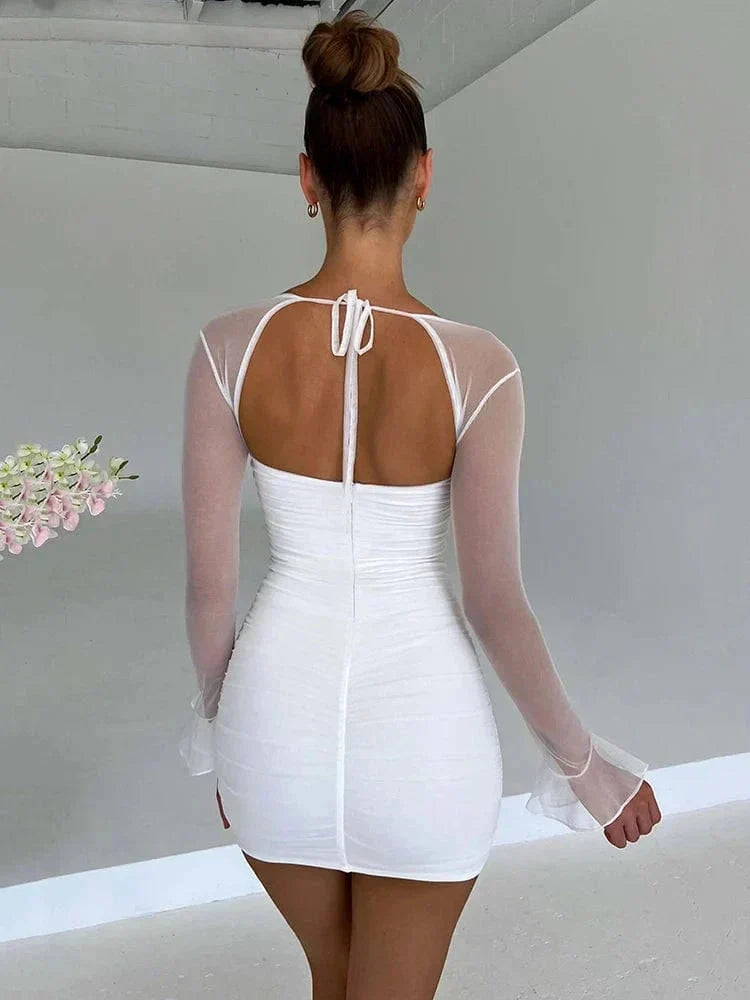 White Astraeon bodycon mini dress with ruched details, fitted style, shown on a model.