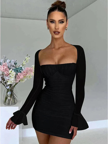 White Astraeon bodycon mini dress with ruched details, shown on a model. Perfect for stylish evening wear.