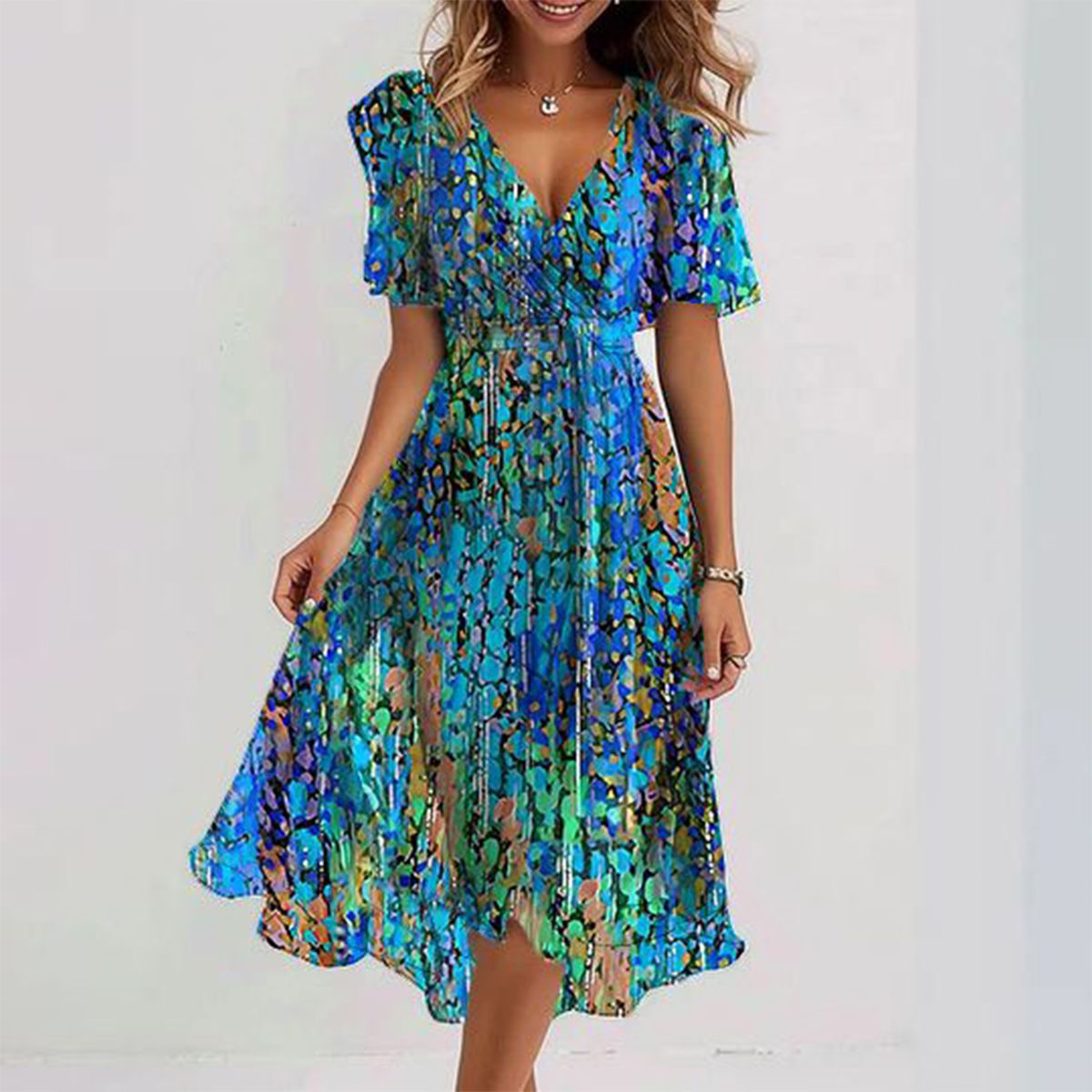 Blue floral V-neck dress with flutter sleeves and a flowing skirt