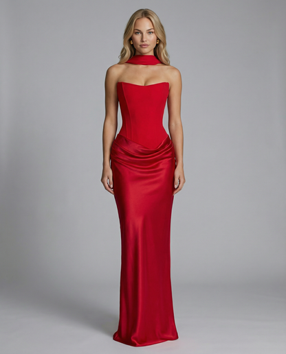 Red strapless satin-look maxi dress with a corset-style bodice and draped skirt.