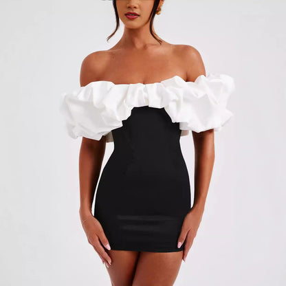Black and white Aurora off-shoulder mini dress, featuring a stylish, fitted design perfect for casual or evening wear.