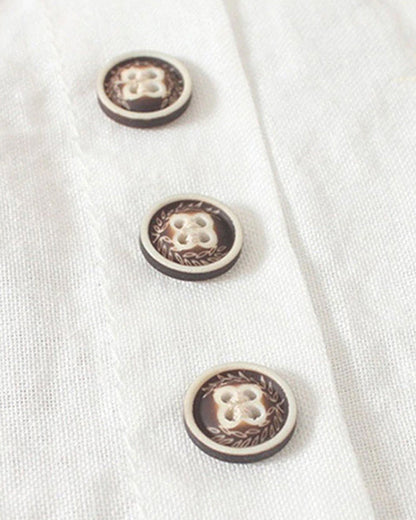 Light beige Beatrice relaxed summer blouse with button detail, featuring a loose fit and short sleeves.