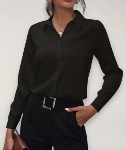 Elegant women's blouse featuring a tailored fit, button-up front, and classic design in soft fabric.