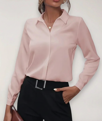 Elegant white tailored button-up women's blouse, featuring a classic fit and stylish collar detail.