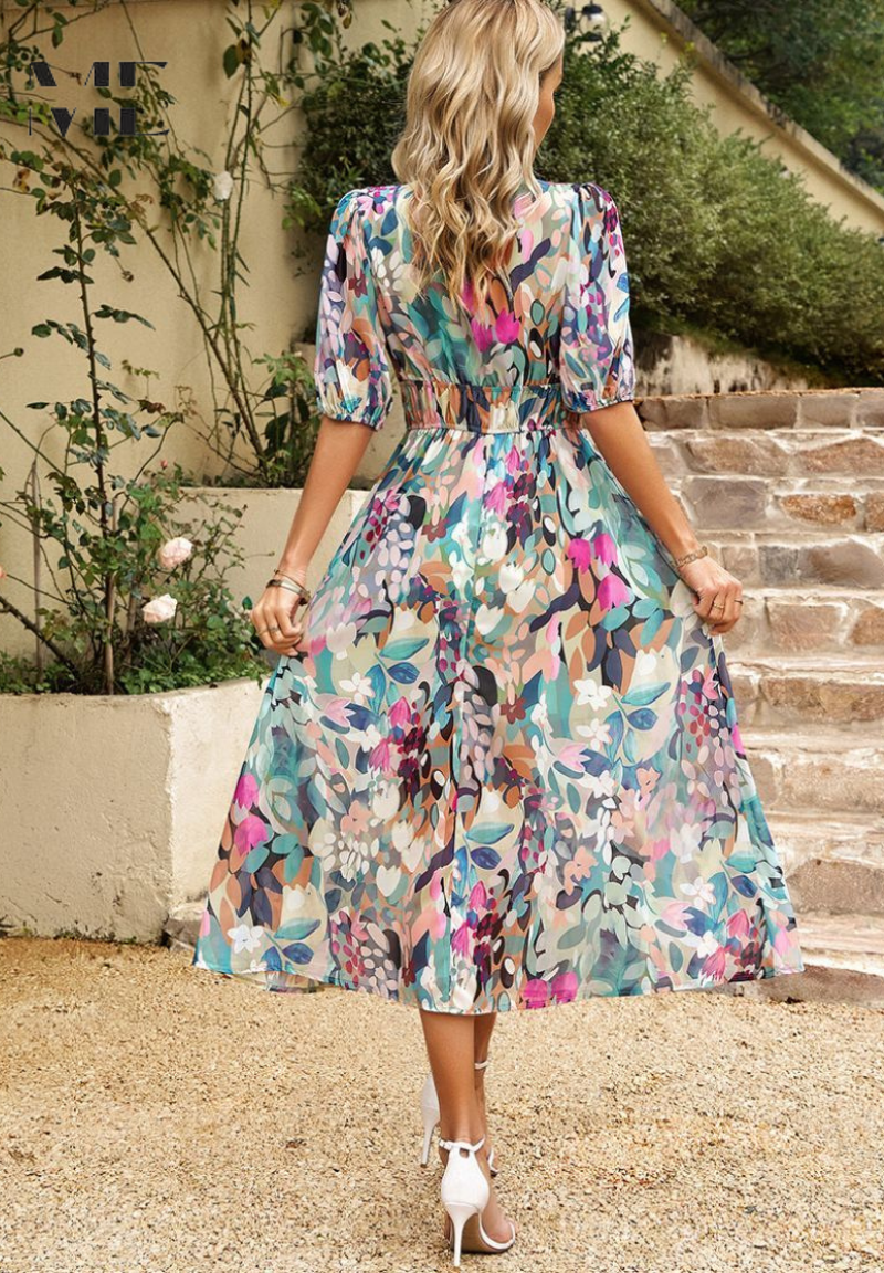 Woman wearing a multicolour floral V-neck midi dress, rear view